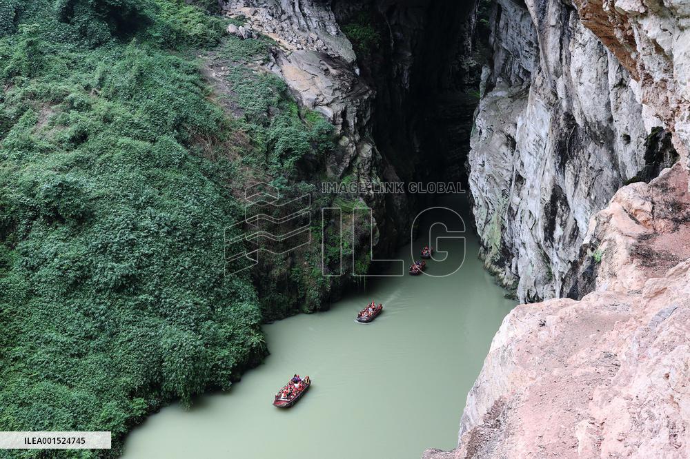 Tourists Cross The Hidden River By Boat To Escape The Heat in Chongqing