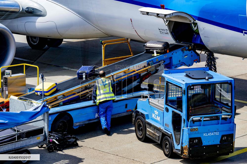 Loading baggage on an KLM Plane - Amsterdam