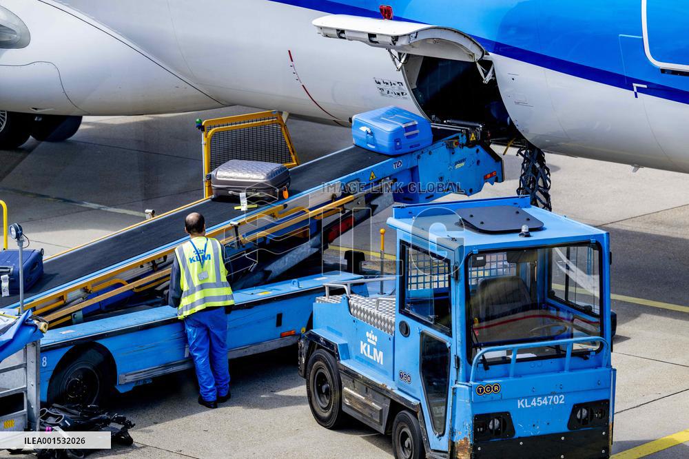 Loading baggage on an KLM Plane - Amsterdam