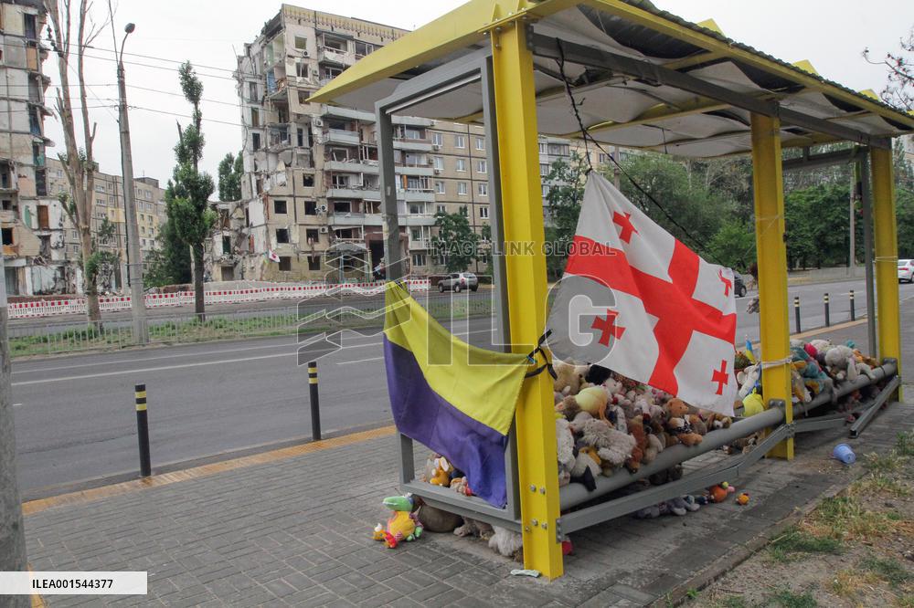 Flowers planted outside residential building bombed by Russians and murals created on walls of surviving blocks In Dnipro