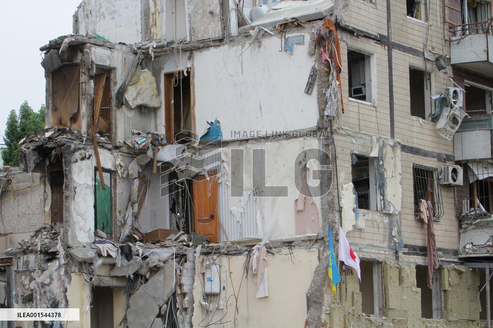 Flowers planted outside residential building bombed by Russians and murals created on walls of surviving blocks In Dnipro