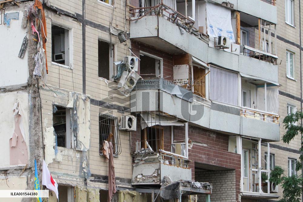 Flowers planted outside residential building bombed by Russians and murals created on walls of surviving blocks In Dnipro