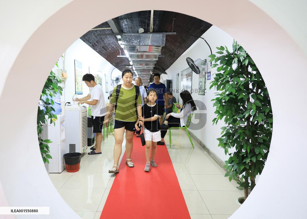 People Take Cool in The Arctic Rock Civil Air Defense Project in Nanjing, China