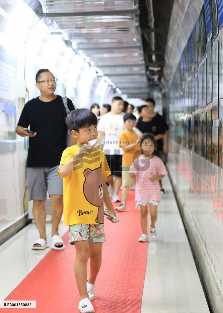 People Take Cool in The Arctic Rock Civil Air Defense Project in Nanjing, China