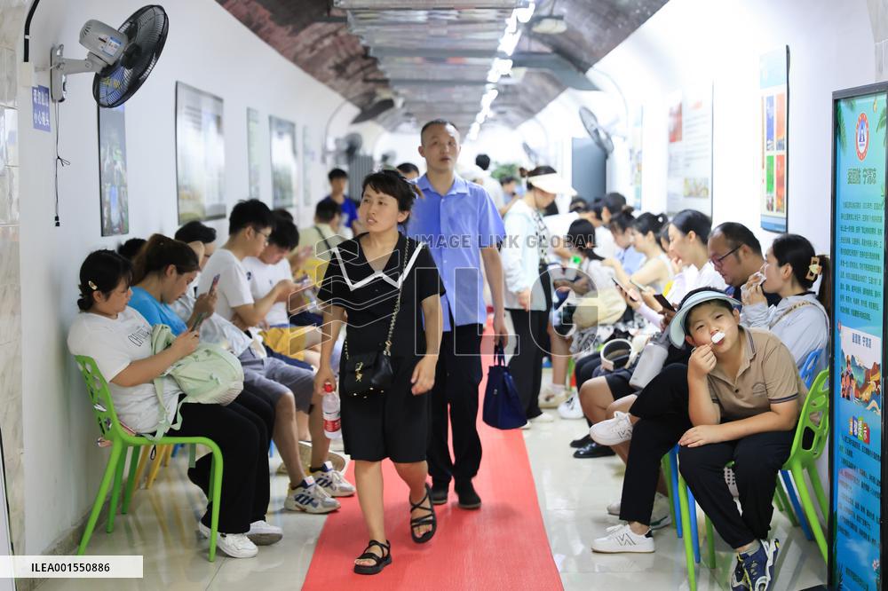 People Take Cool in The Arctic Rock Civil Air Defense Project in Nanjing, China