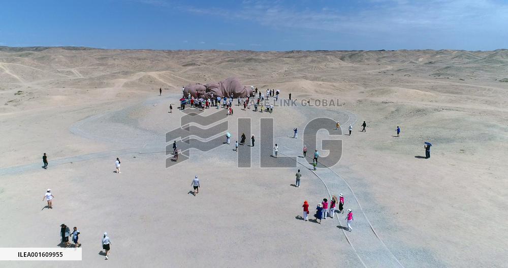 The Sculpture Son of the Earth on The Gobi Beach in Guazhou