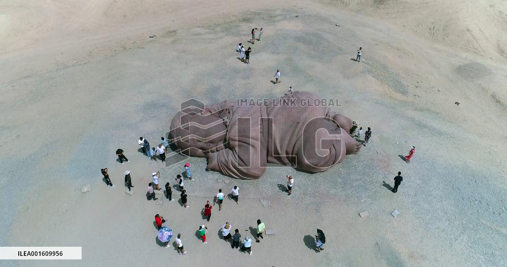 The Sculpture Son of the Earth on The Gobi Beach in Guazhou
