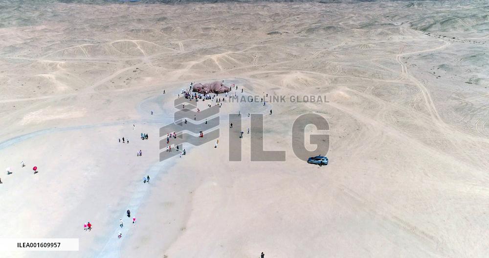 The Sculpture Son of the Earth on The Gobi Beach in Guazhou