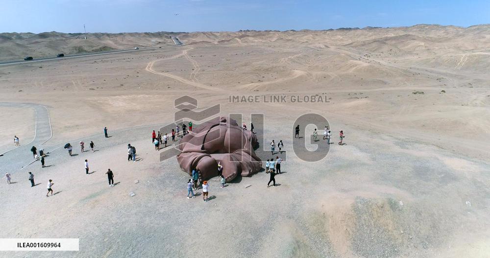 The Sculpture Son of the Earth on The Gobi Beach in Guazhou