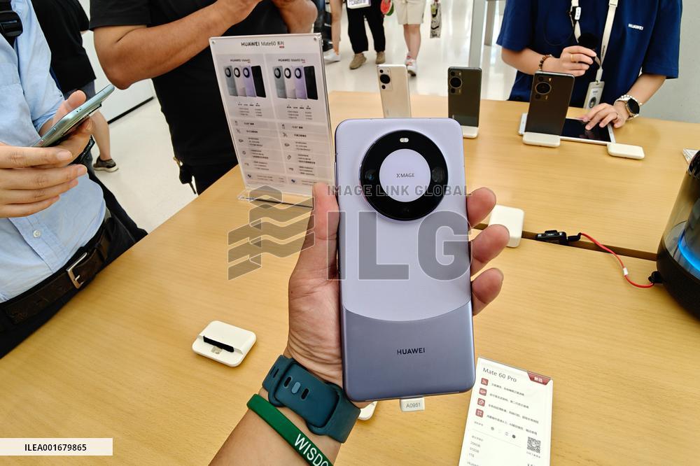 Customers Try Huawei's Mate60 Pro Mobile Phone in Shanghai