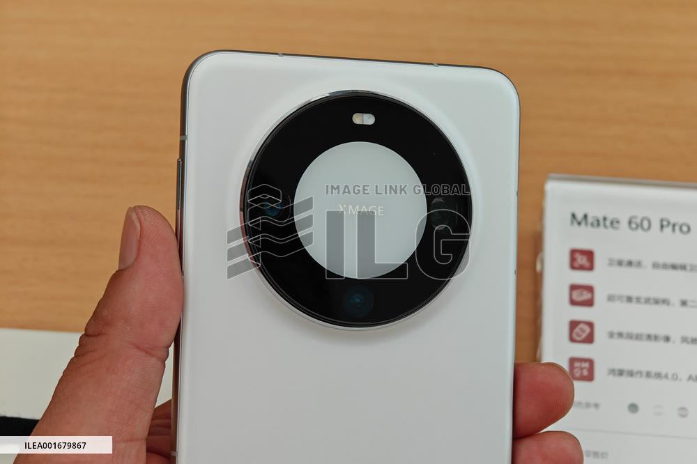 Customers Try Huawei's Mate60 Pro Mobile Phone in Shanghai