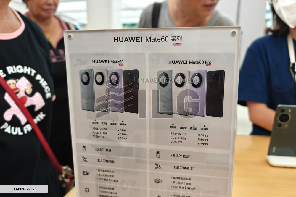 Customers Try Huawei's Mate60 Pro Mobile Phone in Shanghai