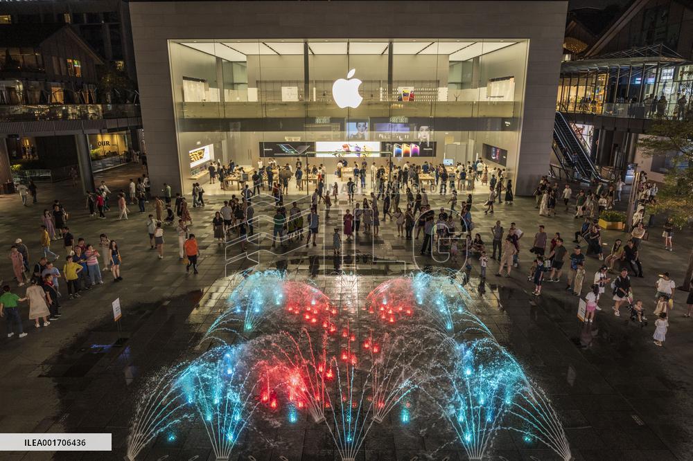 Customers Experience Apple Products at An Apple Store in Chengdu, China