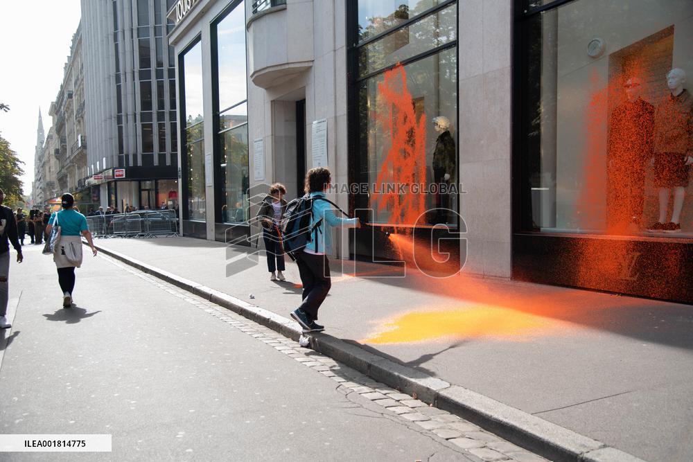 Activists Spray Louis Vuitton Window With Orange Paint - Paris