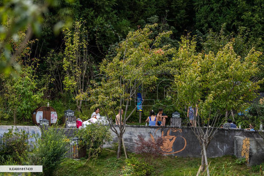 Tourists Soak in Hot Springs in Bijie