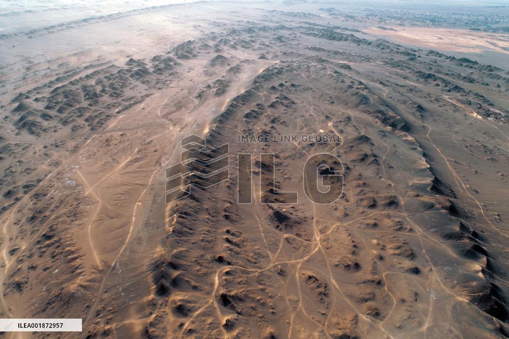 An Elliptical Crater Basin in The Gobi in Hami