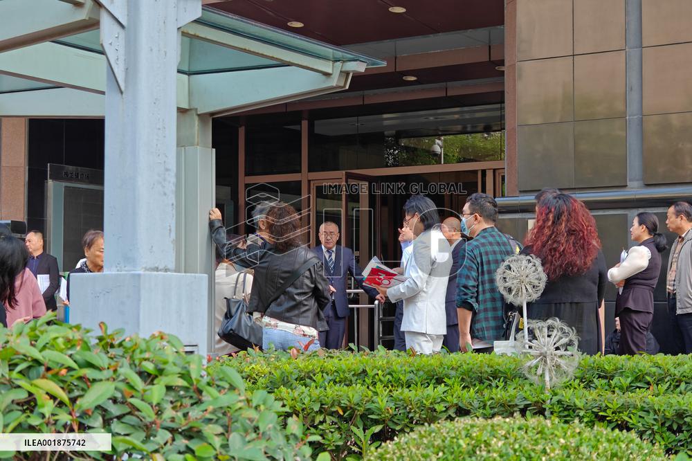 People line up outside the visa office of the U.S. consulate in Shanghai