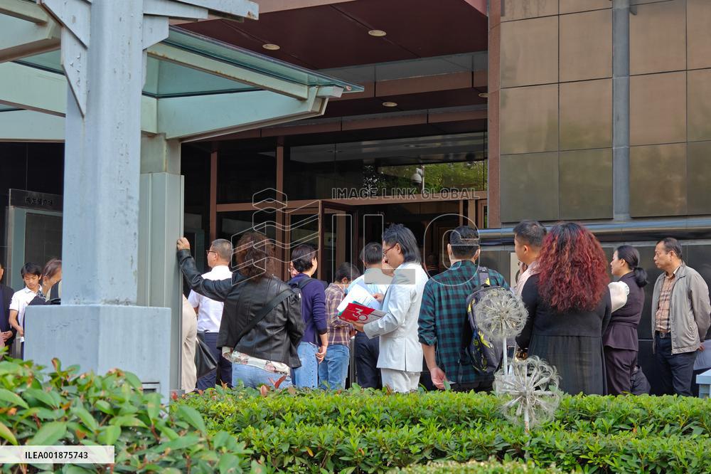 People line up outside the visa office of the U.S. consulate in Shanghai