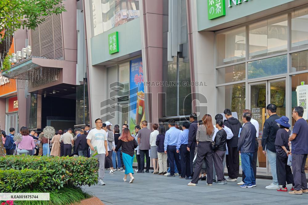 People line up outside the visa office of the U.S. consulate in Shanghai