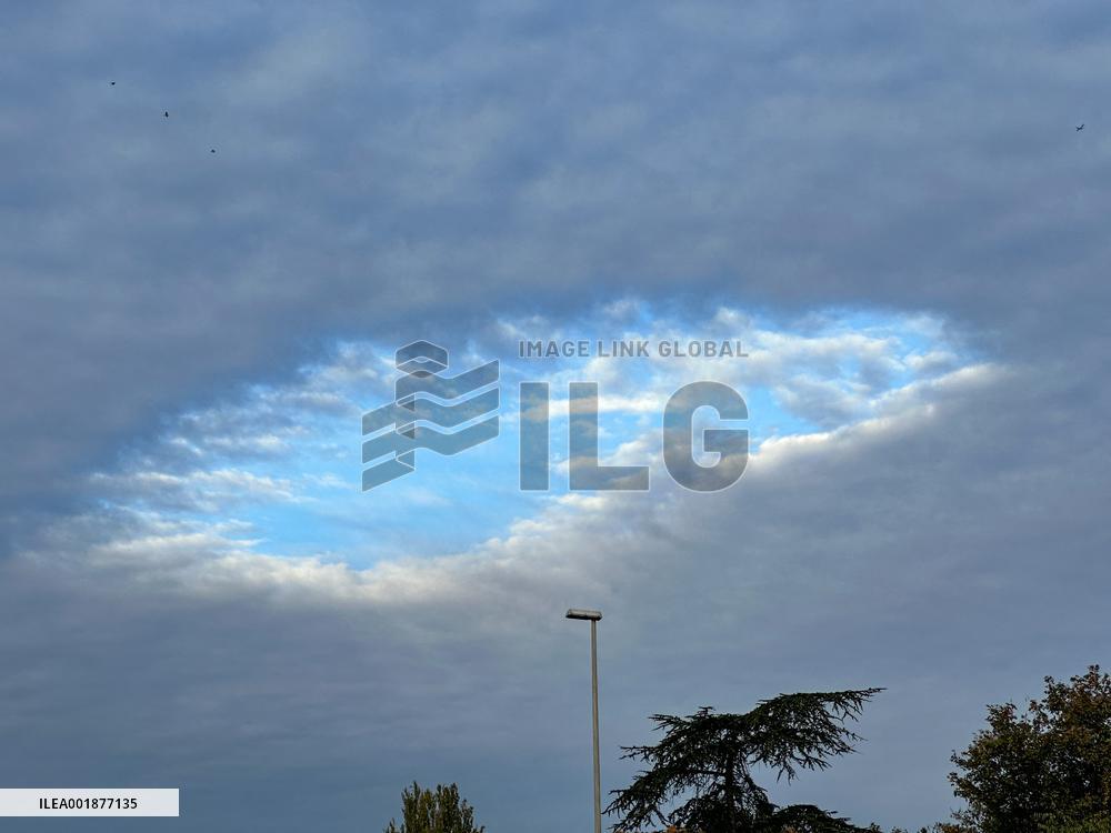 A Rare Cloud Hole Seen In Paris Sky