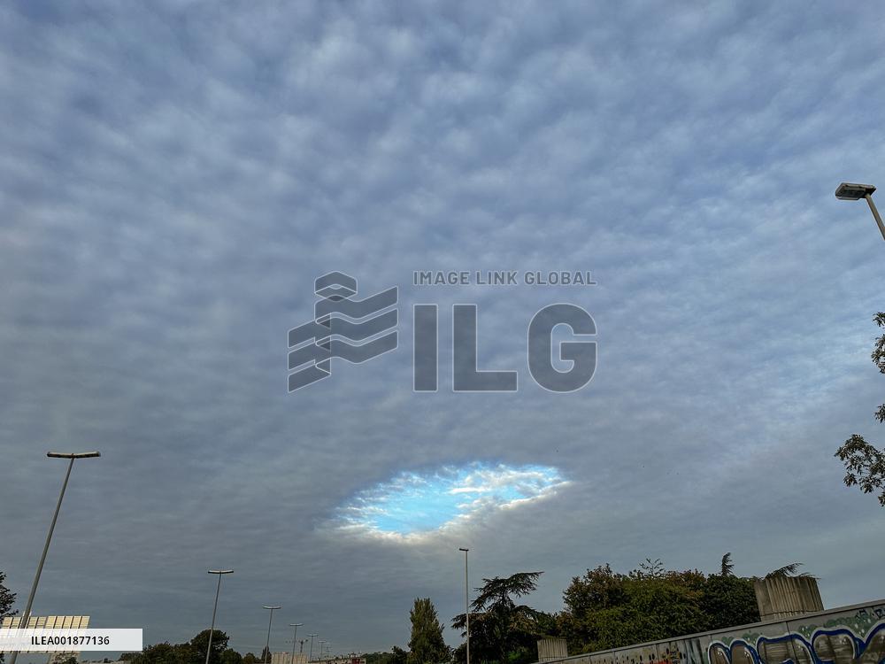 A Rare Cloud Hole Seen In Paris Sky