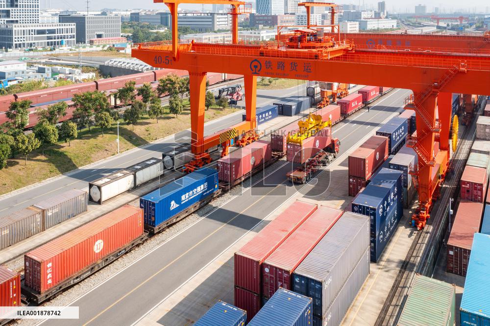 Workers Load Containers onto Vehicles in Nanjing