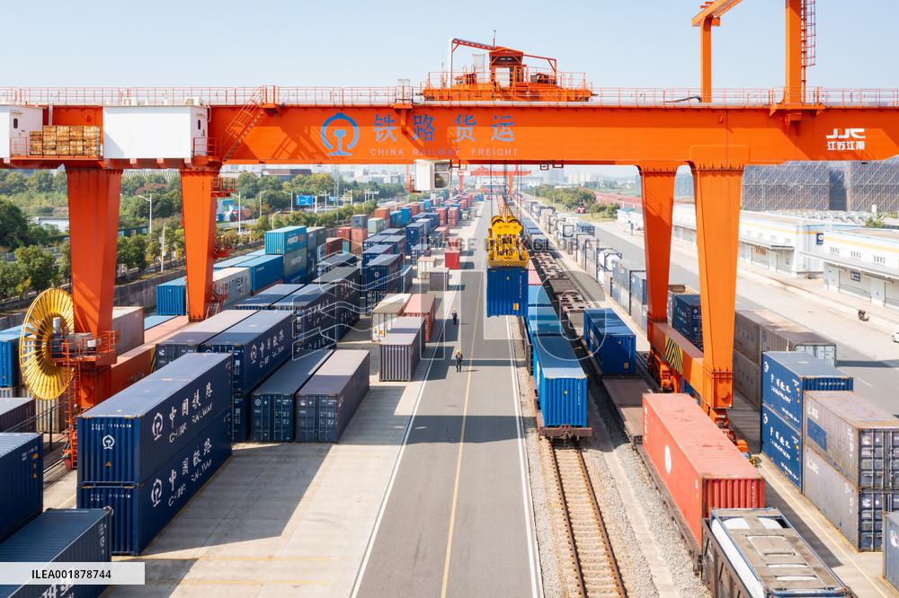Workers Load Containers onto Vehicles in Nanjing
