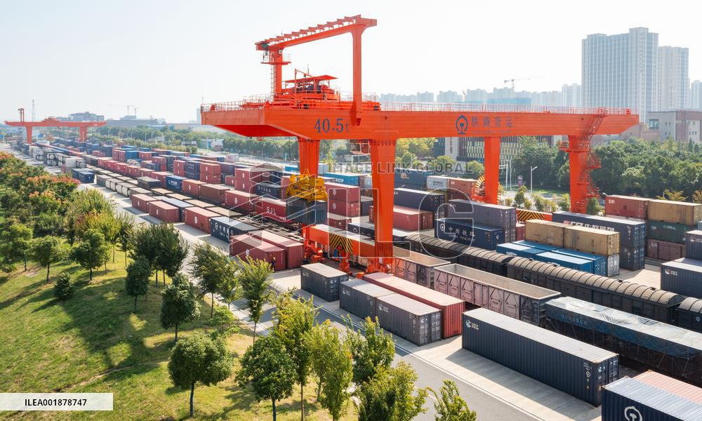 Workers Load Containers onto Vehicles in Nanjing