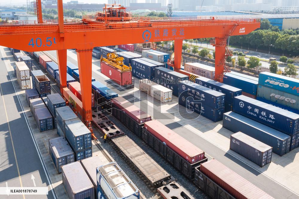 Workers Load Containers onto Vehicles in Nanjing