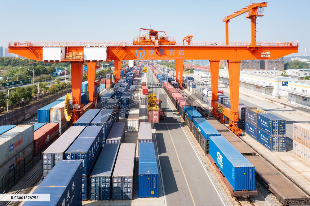 Workers Load Containers onto Vehicles in Nanjing