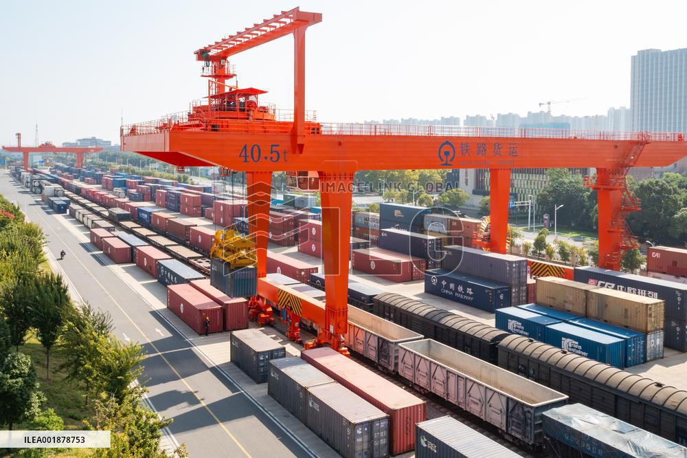 Workers Load Containers onto Vehicles in Nanjing
