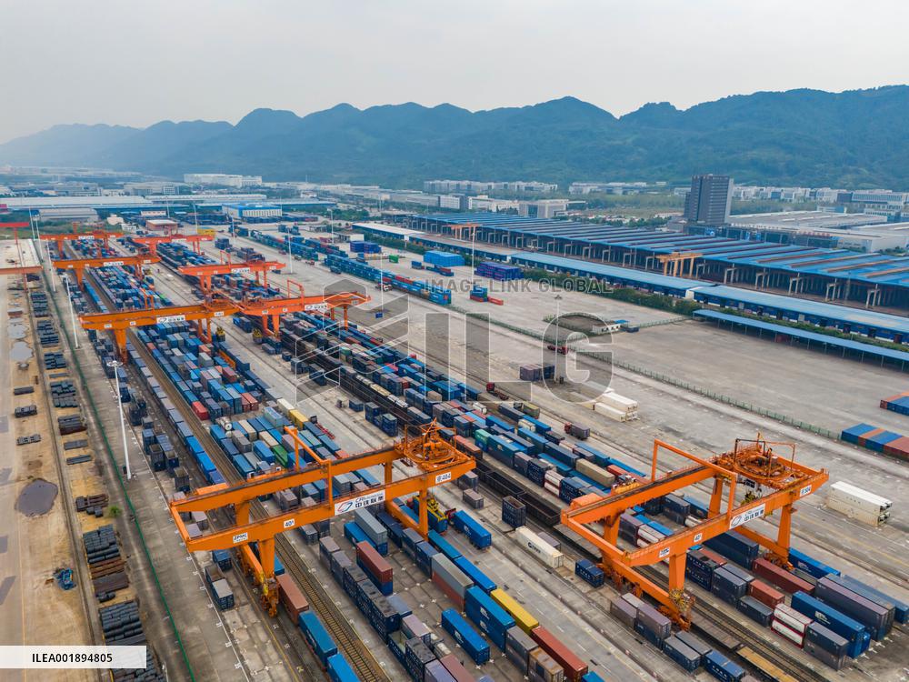 The Western Land Sea New Channel Train At The Railway Container Center Station Waits to Depart.