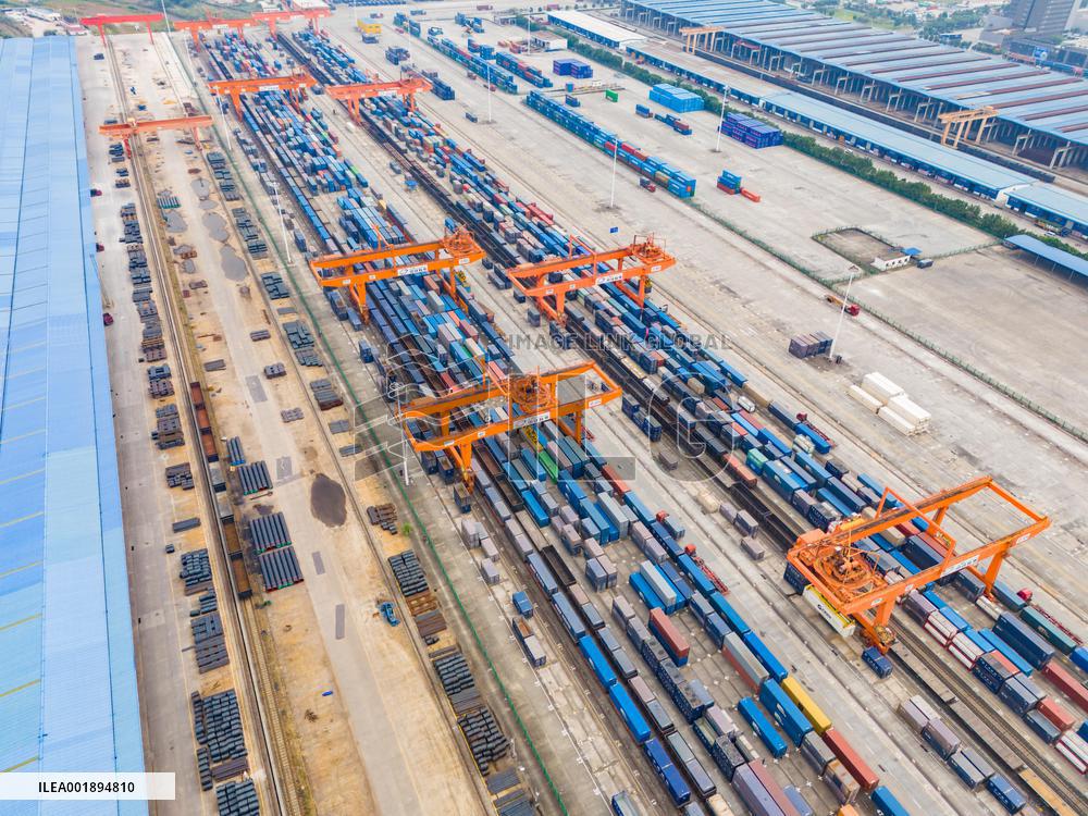 The Western Land Sea New Channel Train At The Railway Container Center Station Waits to Depart.