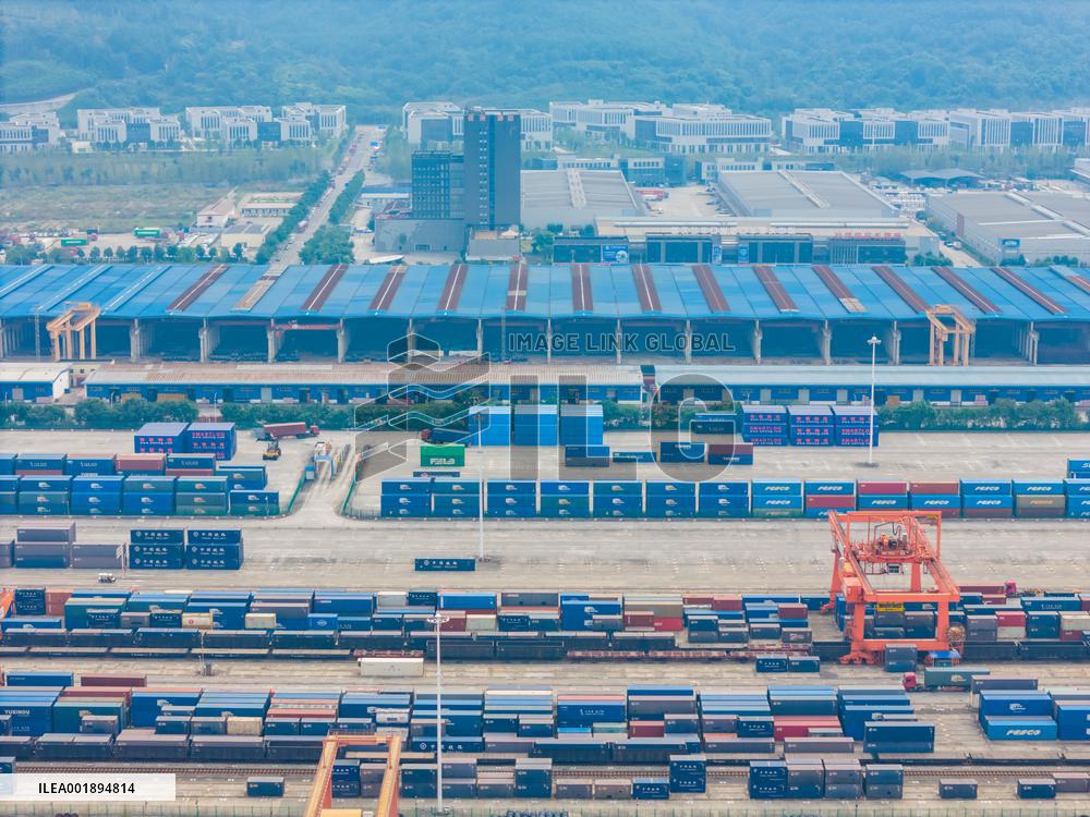 The Western Land Sea New Channel Train At The Railway Container Center Station Waits to Depart.