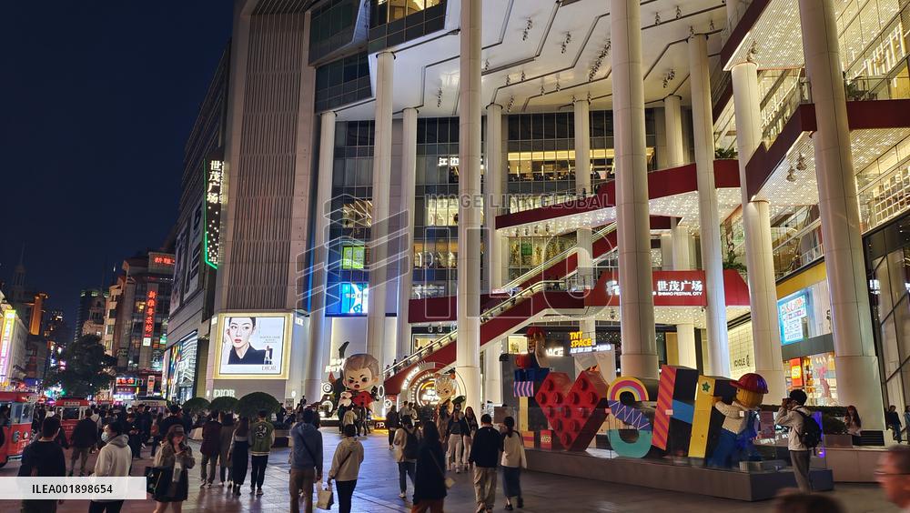 Tourists Visit The Nanjing Road Pedestrian Street in Shanghai