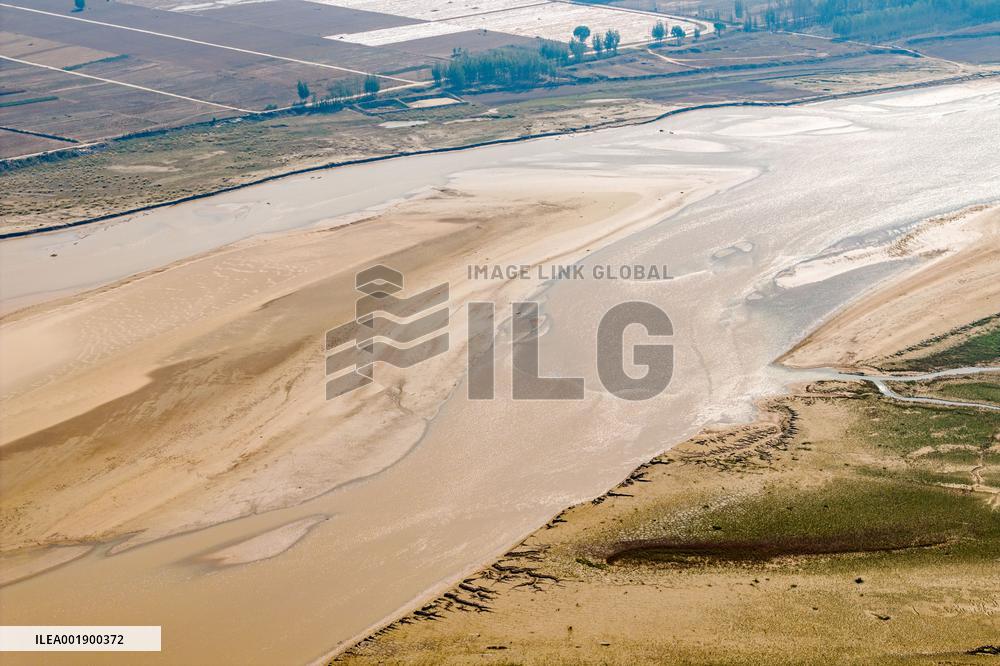 Yellow River Flowing Through Beach Trace