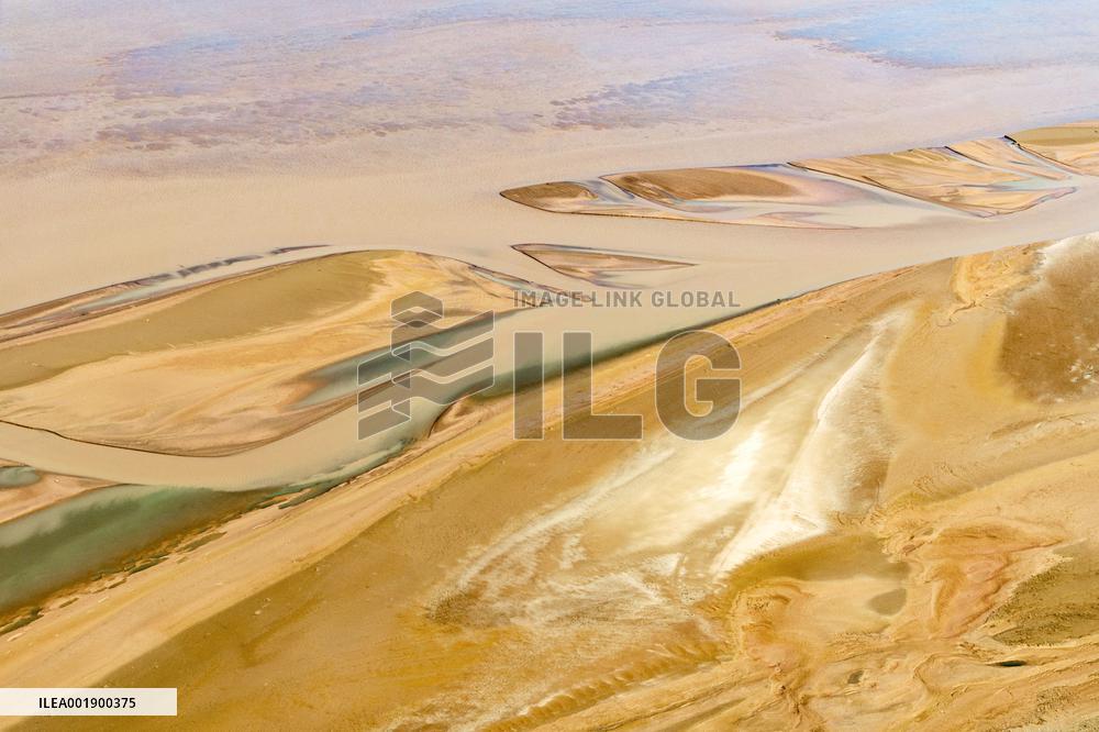 Yellow River Flowing Through Beach Trace