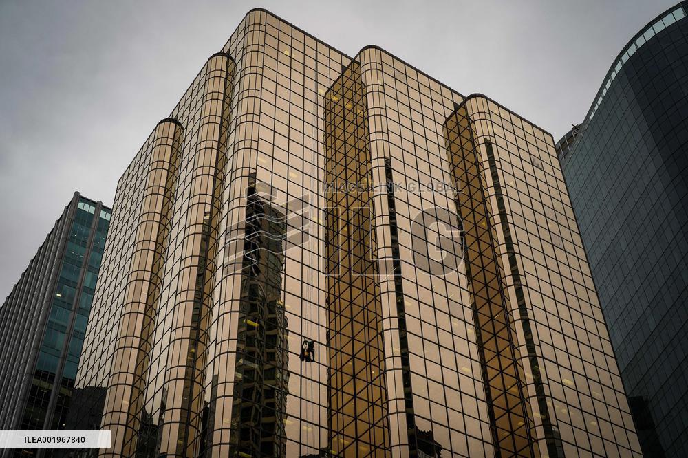 A Window Washer Cleaning Tower Windows - Vancouver