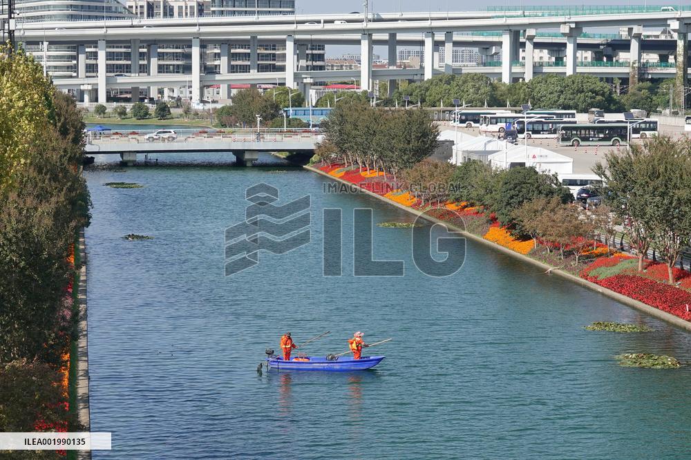 Sanitation Workers Clean A River in Shanghai