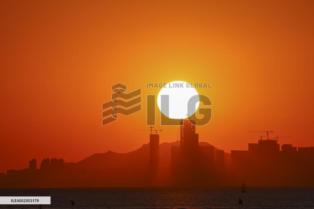 Fishing Boats Sailing at Sunset in Qingdao