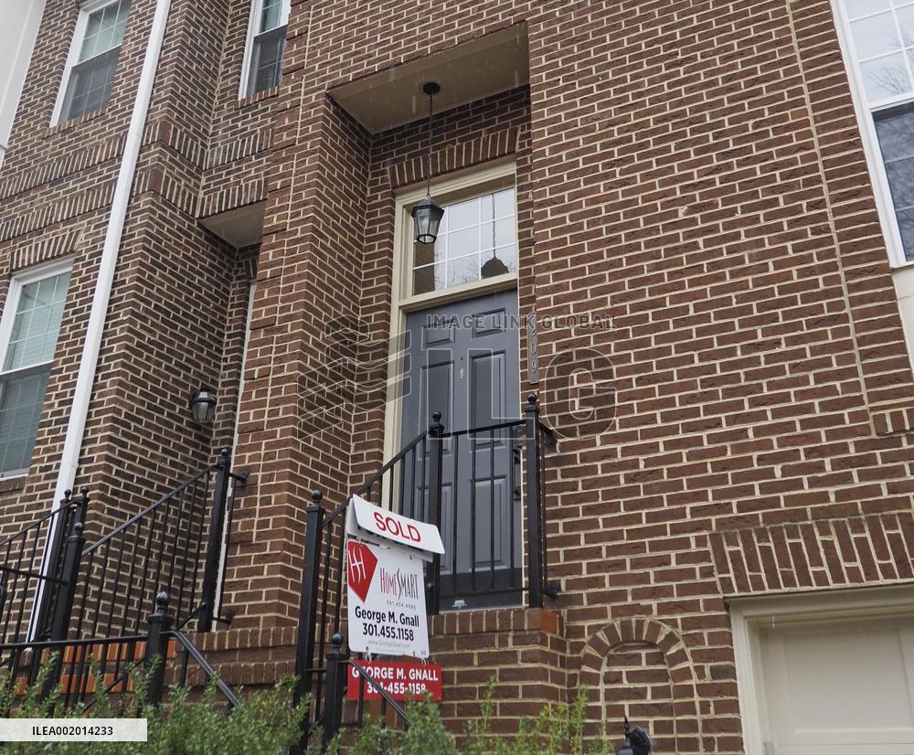 Existing home with "sold" sign