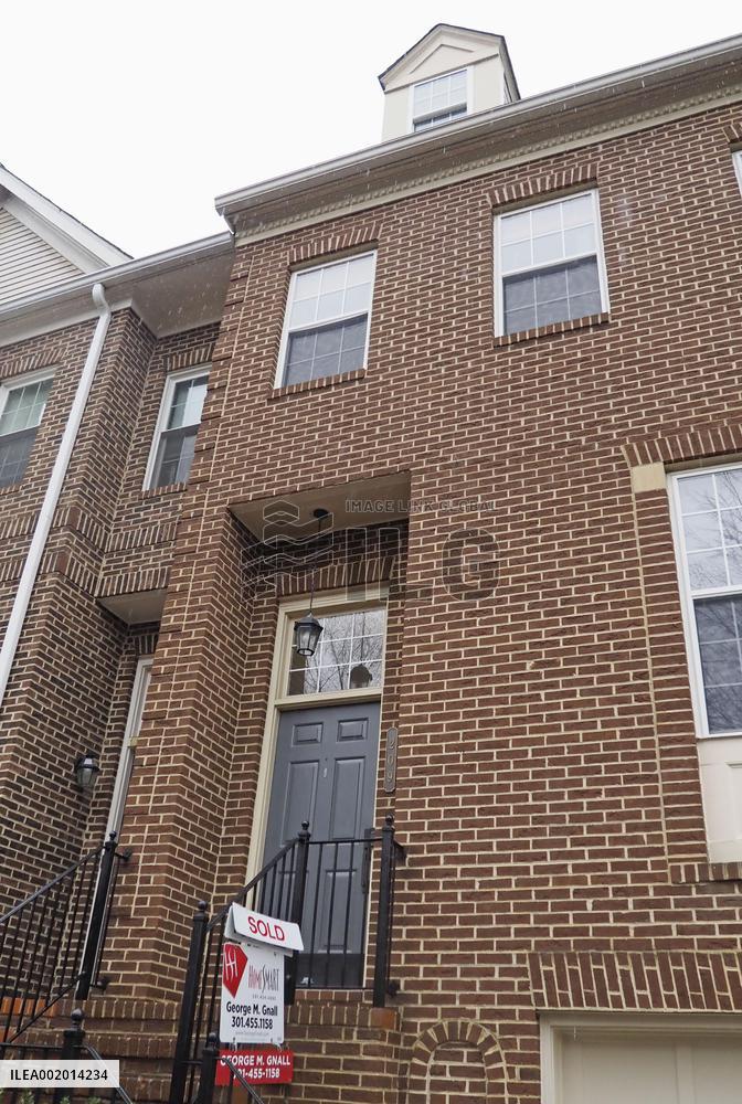 Existing home with "sold" sign