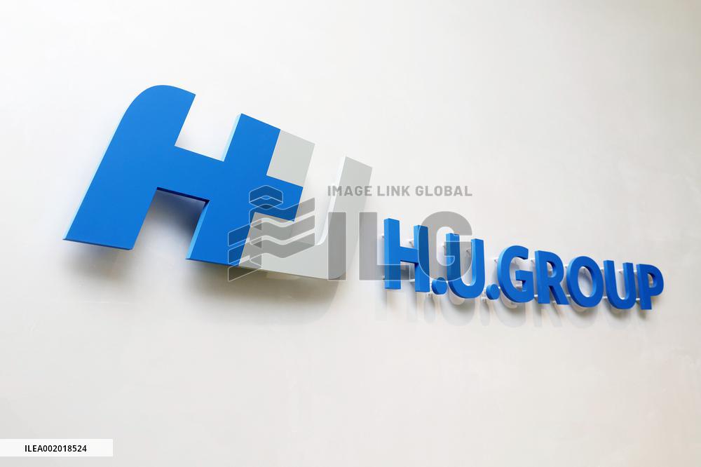 H.U. Group Holdings signage and logo