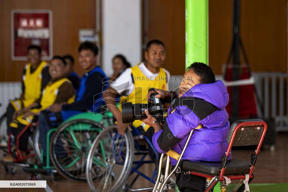 Xinhua Headlines: Disabled Tibetan photographer aims high