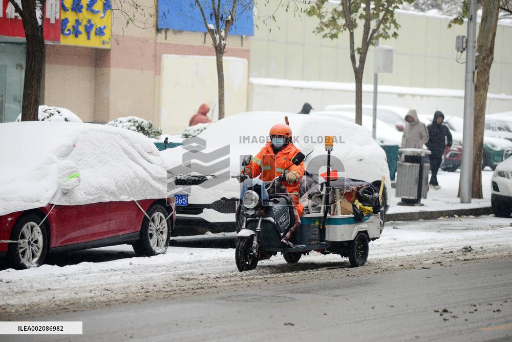 A Courier Rides During Heavy Snow in Beijing