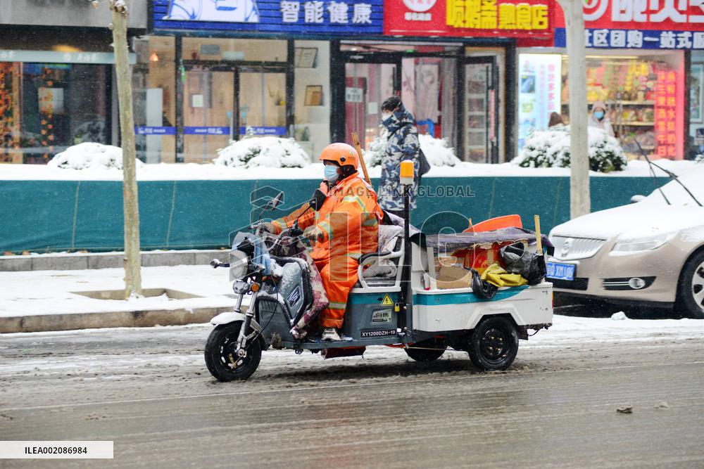A Courier Rides During Heavy Snow in Beijing