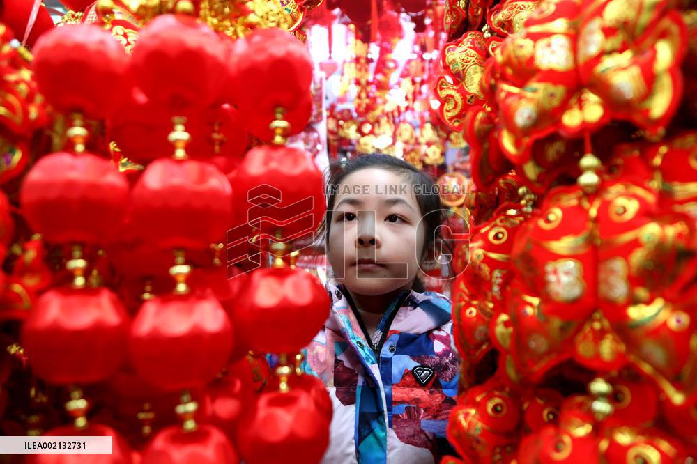 People Shop 2024 New Year Decorations in Lianyungang