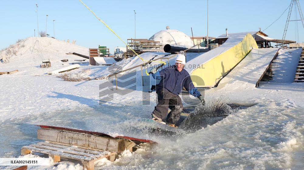 Tricks with wakeboard in frosty weather