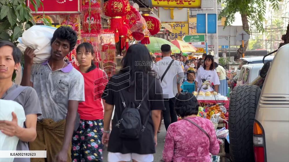Chinatown in Yangon bustling with people buying Spring Festival decorations