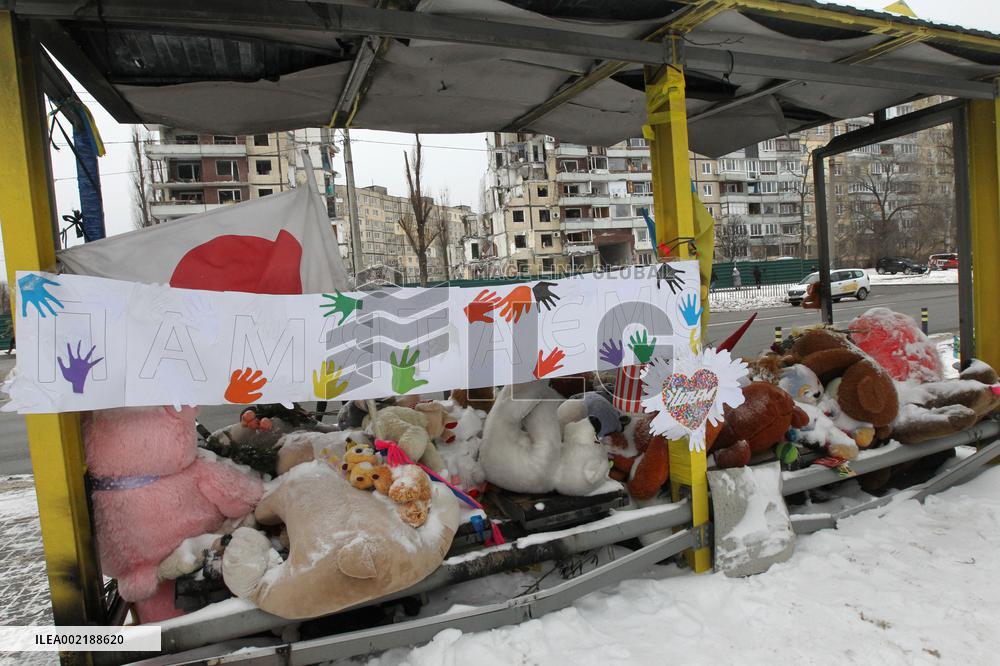 Memorial outside Dnipro apartment block ruined by Russian troops